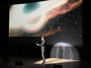 Brian Cox Instagram - Black Holes in Basingstoke (Horizons warm-up show). This sequence (it's a simulation - created from actual physics) was rendered by D-Neg using code developed for “Interstellar” and shows gravitational lensing around a black hole.

#science #horizons