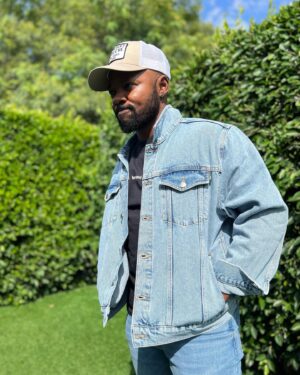 Brian Michael Smith Instagram - Even after all these years, September always feels like “back-to-school” time.

And as I slipped on this jacket today, I thought about how my back-to-school shopping experiences shaped my love/hate relationship with clothes.

I reminded how when I was a kid, everything was so either/or. There were either boy clothes or girl clothes without much in between.

I learned very early on that no matter how I saw myself, clothing dictated how people saw me. 

The designated colors and cartoons were pretty much billboard signs announcing your gender and telling all the other kids who you were and how to treat you.

Growing up clothing was used as a tool correct and undermine my masculine gender expression. 

Back to school shopping was a battle in which I experienced the pain and distress of being erased and overwritten when forced to wear clothes designed for feminine girls. But  later on, once I had the ability to pick my own clothes, I felt the power validation and euphoria of wearing clothes that matched my gender. 

I’ll never forget how much stronger and present in the world I felt when I wore clothes that affirmed my masculinity for the first time.

I’m also reminded of that long period of time  in which, I struggled with clothing that were the right gender but, didn’t fit my body. Either they didn’t sit on me right, or I felt like I was buying clothes to camouflage parts of myself, to hide. 

But now I’m living in a time where companies like @bothandapparel exist. 

Where I can find clothes that both affirm my identity and experience and fit my body.

Clothes that are made for my body, That don’t hide my body or erase who I am. 

This jacket made by a Trans clothing company in collaboration with Transmasc artist, @danielsea_
is the gift I’m rocking for my younger self. 

The reminder that I don’t have deny one part of myself to accept another. That we are and always will be Both/And. 

📸: @laith_ashley 
.
.
.
#representationmatters 
#transisbeautiful #bothand #