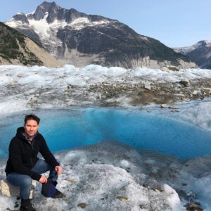 Bryan Singer Instagram - Touched down in a remote spot on a #glacier where no one has ever been  or will go as they are constantly moving and melting. The water hole behind me is nearly 1000 feet deep. #alaska #unfiltered #prehistoric #ice
