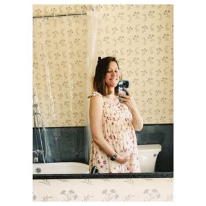 Caitlin McGee Instagram - Well we’re making a person. From scratch! Gotta say I have yet to feel that GLOW *unless said glow is upper lip sweat* but nonetheless we cannot wait to meet this little mango in October. Love you so much already Bug 🤰🐛🥹💗 And thank you to my wonderful hub for being a truly outstanding partner— holding my hair back, cleaning out puke buckets, buying every cereal and popsicle in the county— to name a few. You’re a good one P, I adore you.