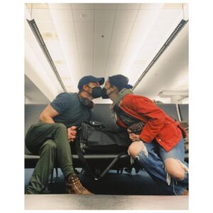 Caitlin McGee Instagram - Rang in the new year flying over three time zones last night with our sedated pup and masks tapes to our faces. It wasn’t a party, we didn’t have champagne, but it somehow it felt like the right way to end 2021. Cranky but together ☺️Cheers friends 🥂
