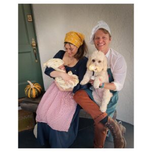 Caitlin McGee Instagram - 🎶the cow as white as breastmilk🎶 
HAPPY HALLOWEEN! 🐮🌽🩸👡✨🫘 
.
.
.
Just a baker, his wife, milky white and the loaf of bread that took 9 months to bake 👩🏻‍🍳🍞