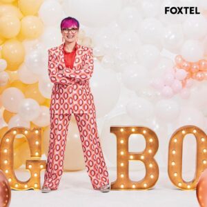 Cal Wilson Instagram - Ooooh is that the June issue of #FoxtelMagazine,arriving in homes right now? Yes, yes it is! 
And it’s only me and me beautiful bakey mates swanning about on the cover, and inside. 

I had the best time working with these three (and our twelve fabulous bakers) what an absolute treat to go to work and laugh all day. Can’t wait for you all to see it. 

#FoxtelMagazine #BakeOffSu #GABO

(Image 1: Cal in an aggressively patterned, but cheerful pink and orange suit. She is standing, arms crossed, between the letters G, B and O, her stance making her legs and body form the missing A. Also visible, how pleased she was with herself for thinking of it. 
Image 2: Four smiling people, (beautifully dressed by @elenimstyling, and delightfully prettified by @juliecooper_makeup ) @darrenpurchese, @rachelkhooks, @natalie.tran and Cal. 
Darren and Rachel are leaning on a ladder, surrounded by celebratory balloons. 
Natalie is seated on a gold coloured chair, with Cal behind her, hands resting on the back of the chair, like she might nick it once the photoshoot’s done. (She didn’t, just to be clear))