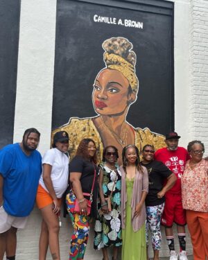 Camille A. Brown Instagram - I have always been proud to represent Southeast Jamaica, Queens, New York! “Queens is in da buildin!!!’” A very special thank you to  @jamaicaartscenter for including me in this series and for this massive acknowledgment! Many thanks to JCAL's Executive Director, Leonard Jacobs, JCAL's Artistic Director, Courtney Ffrench , NYC Parks Department Senior Public Art Coordinator, Elizabeth Masella, and Wendy A. Berot. Council Member, Nantasha Williams, District Leader and former Council Member, I. Daneek Miller, NYC Parks Queens Borough Commissioner, Michael Dockett

I am very honored to be on the wall with LL COOL J, Sweet Tee, Q-Tip, Jackie Robinson, Gregg Vance (Coach Chuck), Lani Guinier, W. E. B Du Bois, Naomi Osaka, and Count Basie! 

And shout out to the super talented artists who created the murals: 

Eric Black 
Justice Levenson 
Tyler Blau (LAG!) 
Nicole Wang 

Original pic by @josefinasantos 

Shout out to my family and dance family who came out to support! 

I was asked what was my hope when Black youth look at this mural. That all things are possible and to BELIEVE!!! There will always be challenges, but keep living your dreams, shoot for the universe, and be yourself in all spaces.

If you’re ever in Jamaica, Queens stop by Daniel O'Connell Playground and check out
#queensreflections 

Gratitude!