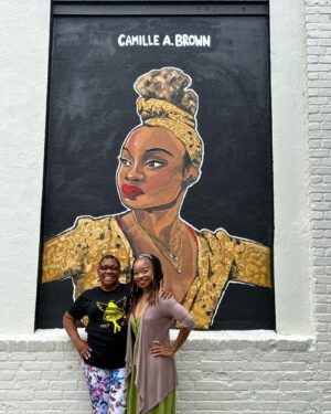 Camille A. Brown Instagram - I have always been proud to represent Southeast Jamaica, Queens, New York! “Queens is in da buildin!!!’” A very special thank you to  @jamaicaartscenter for including me in this series and for this massive acknowledgment! Many thanks to JCAL's Executive Director, Leonard Jacobs, JCAL's Artistic Director, Courtney Ffrench , NYC Parks Department Senior Public Art Coordinator, Elizabeth Masella, and Wendy A. Berot. Council Member, Nantasha Williams, District Leader and former Council Member, I. Daneek Miller, NYC Parks Queens Borough Commissioner, Michael Dockett

I am very honored to be on the wall with LL COOL J, Sweet Tee, Q-Tip, Jackie Robinson, Gregg Vance (Coach Chuck), Lani Guinier, W. E. B Du Bois, Naomi Osaka, and Count Basie! 

And shout out to the super talented artists who created the murals: 

Eric Black 
Justice Levenson 
Tyler Blau (LAG!) 
Nicole Wang 

Original pic by @josefinasantos 

Shout out to my family and dance family who came out to support! 

I was asked what was my hope when Black youth look at this mural. That all things are possible and to BELIEVE!!! There will always be challenges, but keep living your dreams, shoot for the universe, and be yourself in all spaces.

If you’re ever in Jamaica, Queens stop by Daniel O'Connell Playground and check out
#queensreflections 

Gratitude!