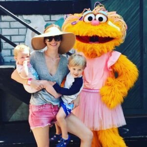 Candace Bailey Instagram - Spent the day at Sesame Place with my little munchkins. Not quite sure who this big orange monster is, but Manning wanted a picture, so that's what we did. In this picture, Annabelle just peed on me through her swim diaper, Manning was sliding off of me, and my boob was about to pop out. For all of the moms who make it look easy, I applaud you. Clearly, I am NOT one of those moms. #reallife #momlife #wouldntchangeadamnthing #manningbaldwinrosen #annabellegracierosen