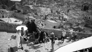 Cary Joji Fukunaga Instagram - If you don’t like spoilers then don’t look at these BTS from Italy - Matera & Gravina di Puglia: 1. dailies still from the lab from our IMAX footage 2. #shotonmyiphone finding an angle for the stand-off in the square 3. Three blind mice: Linus, Lea and I (Greg Williams photo) 4. Mark-up explaining how I wanted to combine Gravina de Puglia to Matera for the VFX team 5. Video of “Low mode” cam op Ossie McLean carrying a hefty IMAX load with Garry Moore in support 6. Video of SFX team making things go boom 7. Another BTS by Nicola Dove in Matera 8. Video of Ossie McLean crossing union lines to help standby Art Director Arwel Evans perfect the line in Gravina di Puglia 9. A squadron of DB5’s forming up before the shoot day in Matera 10. My “improv” sides at the Sapri train station
