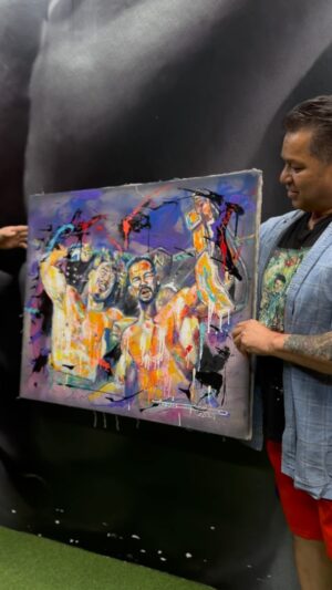 Chavo Guerrero Jr. Instagram - @art_by_gus63 proudly revealed his masterpiece painting here at The Cave to WWE legend Chavo Guerrero, capturing the essence of the moment in vivid colors and dynamic brushstrokes of Eddie and Chavo winning the tag team championship belt the second time!