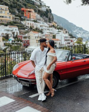 Cheryl Des Vignes Instagram - Saying some player shit to a girl I always wanted 🏁

Two weeks in Italy at the beginning of May also marks 1 year of our engagement. Decided we couldn’t go to a place as beautiful as the Amalfi Coast and not celebrate by finally taking engagement photos. Somehow we got down to these 10, but we’ve been staring at all 90 since we got them back lol. Maybe we’ll go through them all on YouTube 🤔

📸: @amalfitana_photographer 
🏎️: @spiderlifestyle