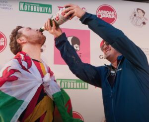 Chris Broad Instagram - It’s finally over. All great stories need a fitting ending and yesterday we got ours.  Half a month spent furiously peddling over 1,000km across Japan’s mountain ranges and megacities, with an astonishing $1 million raised for the Immune Deficiency Foundation, culminating with hundreds of amazing folks cheering us on across the finish line at Tokyo Tower.

The journey wasn’t easy; my back and leg muscles are stuffed. And I won’t forget the feeling of my heart almost exploding while ascending 1,200m at the base of Mount Fuji.  There were some genuinely terrifying moments in tunnels, pedalling frantically whilst sandwiched between a concrete wall and a ten ton truck.  Falling off the bike on to a stone pavement covered my already shattered legs in cuts and bruises.  Yet through it all, I always felt a part of something bigger than myself. 
Cycling alongside the seemingly unstoppable Connor and knowing that every step of the way, people around the world were cheering us from this bloody incredible community was genuinely the greatest motivator of all.  Without Pete firing us up the second week, the struggle would have been a nightmare. Ian saved our bikes more times than I can count and Paul was there to capture every moment and raise our spirits every morning along the way.
 And without our brilliant guests, Garnt, Felix and Natsuki, the endless cycling would’ve descended into monotony.   It was a team effort in every sense, though make no mistake, Connor absolutely earned this victory. The journey was no easy task but to undertake it all while simultaneously entertaining 25,000 viewers everyday with a shoulder mounted camera is borderline insanity. The man is practically the Welsh Terminator. 

I’m immensely grateful to him for convincing me to do this once again and to see it through from start to finish.   We’ll be working tirelessly to edit the full edited Cyclethon 3 episode for Abroad in Japan in the coming weeks guys. Can’t wait to share it with you all!

It’s my birthday this week and it seems I’ve already had the best birthday present of all. 

(Well unless of course, someone plans to gift me a barrel of Camembert of course😉).