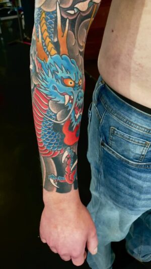 Chris Garver Instagram - Finished a lot of projects this week! Thoroughly enjoyed working on this one too.

#raijintattoo  #sleevetattoo  #sleeve  #colortattoo  #japanesestyletattoo #dragontattoo  #nyctattoo  #nyctattooartist  #thesolidink