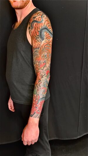 Chris Garver Instagram - Finished up this sleeve today! Love all of the life and death struggle theme tattoos that I’ve been getting to do lately.

#tigertattoo  #tattoo #tattoosleeve #snaketattoo #nyctattoo  #nyctattooartist