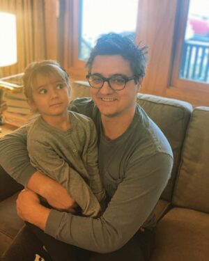 Chris Hayes Instagram - This little one turned 5 today. She is the funniest, wittiest, most delightfully eccentric little wonder. She loves dogs, both Shadow and dogs generally, loves musicals and can sing any lyric after hearing the song once. She is a top tier snuggler, and born performer though she doesn’t love having her photo taken (see above. @kateashaw tried her best with her on my lap!) 

Her ask for her birthday was a visit to the Empire State Building. Her brother and sister love her so much and she keeps all of us laughing. We all lucked out.