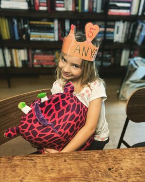 Chris Hayes Instagram - This little one turned 5 today. She is the funniest, wittiest, most delightfully eccentric little wonder. She loves dogs, both Shadow and dogs generally, loves musicals and can sing any lyric after hearing the song once. She is a top tier snuggler, and born performer though she doesn’t love having her photo taken (see above. @kateashaw tried her best with her on my lap!) 

Her ask for her birthday was a visit to the Empire State Building. Her brother and sister love her so much and she keeps all of us laughing. We all lucked out.