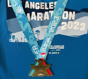 Chris Raab Instagram - What an incredible experience it was running the LA marathon!!! Still buzzing from the festivities! So many creative participants and supporters along the run! And obviously my favorite were the poop signs💩