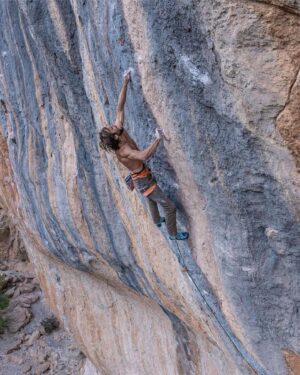 Chris Sharma Instagram - Repost from @tenayaclimbing
•
Sleeping 🦁 💤

@chris_sharma, on the first ascent of Sleeping Lion (9b /5.15c), El Pati, Siurana.

📷: @giancolafoto

#makeithappen #climbing #siurana