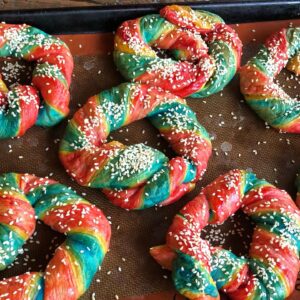 Chris Tallman Instagram - My wife is the best. She made rainbow bagels, just like THE GREAT BRITISH BAKING SHOW! Yummmm.