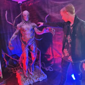 Christian Ganiere Instagram - Thought it would be fun to reconnect with my old buddy #Vecna at @proudnerdconventions #welcometostarcourtcinema Today in Koln... Apparently I was wrong. Guy still doesn't like me. Even after all this time...
.
.
#ChristianGaniere #IamNumber010 #NumberTen #Number010 #IamNumberTen #Strangerthings #Strangerthings4 #strangerthingsedit #strangerthingscast #Strangerthings4life #strangerthingstv #Rainbowroom #strangerthings #Hawkinslab #strangerthingsedit 
#netflix #netflixseries #hawkinsnationallab #rainbowroom #upsidedown #elevenstrangerthings #dufferbrothers #strangerthingsfan #theupsidedown #hawkinsnationallaboratory #strangernumbers #hnl
