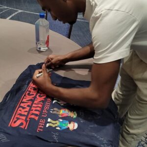 Christian Ganiere Instagram - Day One of #strangerconchi and I've already had a total blast!! Got to meet some amazing fellow cast members and talk to an audience of fans. Also got the totally cool and one of my favorites @therealcalebmclaughlin and got him to sign my Stranger Things t-shirt that I had all the cast sign when I was on set. It's my most prized possession. Also met @francescareale @gabriellapizzolo and got to hang with my buddy @chesterrushing who is the BEST MC Ever!!! This has been a blast so far. Thank you to all the fans who have come by! Thank you so much @creationent for having me. It's been such an honor!
.
.
.
#strangerthings #NumberTen #IamNumberTen #Iam010 #Hawkinslab #strangerthingsedit #strangerthingsedits 
#netflix #netflixseries #strangerthings4 #hawkinsnationallab #rainbowroom #strangerthingscast #upsidedown #elevenstrangerthings #dufferbrothers #strangerthingsfan #theupsidedown #hawkinsnationallaboratory #strangernumbers #hnl #christianganiere 
@strangerthings4.updates 
@strangerthings4.updates
@stranger4news
@strangerthingsnetfliix
@thestrangerhell
@strangerthingslab