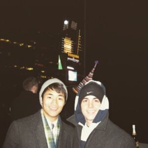 Christopher Larkin Instagram - Times Square. New Year’s Eve. 2008. My fellow classmate / roommate @johnny_deluca and I are living up in Washington Heights. We’re both theater majors. We’re often dead broke. To make ends meet, John works as a waiter in Columbus Circle. I work as a doorman in Times Square (arguably the last place you want to be on New Year’s Eve). Since I can’t get out of my shift, John hops the A train from 181st to 42nd to keep me company. The streets have been barricaded. Security is tight. I construct a fake letter on hotel stationary stating Mr. DeLuca is a guest. I run it by 2 cops...and it works. We make our way to the top floor where a crowd has gathered. Management has refused access to the roof. It’s perfectly safe, but the powers-that-be won’t budge. Guests have paid top dollar to be blocks away from the action. To watch the ball drop from the greatest location imaginable. Needless to say, but everyone is pissed. Like the complete morons that we still are to this day, John and I lead the entire gang to the roof. We unlock the door. We ascend the stairs. We count down from ten. We’re handed champagne. We have no idea who it’s from. We throw it back anyway. This photo gets taken. It’s now past midnight. A new day. A new year. We head down to the lobby so I can clock out, and then we take the A train back home.  Happy birthday, brother. We’ve seen each other through a lot of highs and lows since then. And there’s plenty more to come. Plenty of highs. Plenty of lows. Let’s keep seeing each other through.