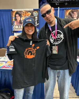 Colleen O'Shaughnessey Instagram - Thank you so much @hill_country_comicon !! ❤️

And thank you to all of the attendees and for sharing your tremendous talents with me! I received another awesome shirt by @spadedesigns_  He made me Charmy Bee!! LOVE IT! 
Thank you for the Michigan National Championship shirt from this cutie and her dad. More amazing artwork - the beautiful Wasp pic by @havoc0325 and the super cool Sonic poster in the last pic by @gilbertperezart ! 

And oh my goodness, that little girl who proves that you can be a princess and a fairy and wield an axe all at the same time!! 🧚💪