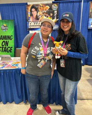 Colleen O'Shaughnessey Instagram - Thank you so much @hill_country_comicon !! ❤️

And thank you to all of the attendees and for sharing your tremendous talents with me! I received another awesome shirt by @spadedesigns_  He made me Charmy Bee!! LOVE IT! 
Thank you for the Michigan National Championship shirt from this cutie and her dad. More amazing artwork - the beautiful Wasp pic by @havoc0325 and the super cool Sonic poster in the last pic by @gilbertperezart ! 

And oh my goodness, that little girl who proves that you can be a princess and a fairy and wield an axe all at the same time!! 🧚💪