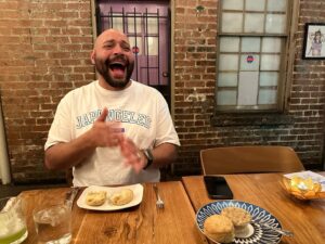 Colton Dunn Instagram - Absolutely amazing dinner with the homies at @rosesluxury in DC. This is my face after taking a bite of a homemade biscuit topped with a honey butter fried chicken skin spread. FRIED CHICKEN SKIN IN BUTTER!