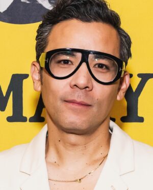 Conrad Ricamora Instagram - Glasses: @tomford 
Suit: @lemaire_official 
Boots: #bottegaveneta
Chain: @gorjana