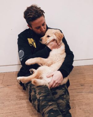 Corey La Barrie Instagram - He’s grown on me.. I can’t stop squishing his cheeks 😍🐶