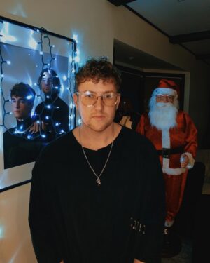 Corey La Barrie Instagram - I swear this Santa is following me 🎅🏽👁