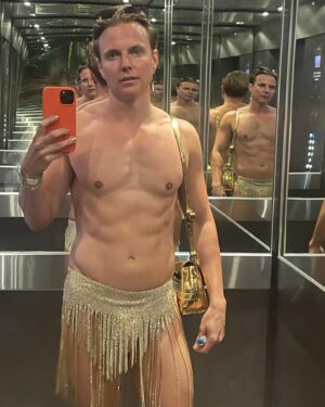Courtney Act Instagram - This year’s Mardi Gras look and I didn’t get a single full length photo! A gorgeous @marcosquared top and sexy crystal chainmail skirt by @olivia_deur_couture. I was going to wear the same skirt to the after party but when I realized it had 7 hook & eyes, 2 pop studs and a zip! I didn’t like my chances of getting back into at 3am after peeing in the Hordern toilets! I had a less structured version made on a belt for the after party which you can see in the last I wore until after sunrise.