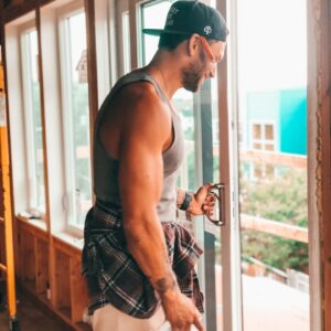 Curtis Hussey Instagram - Straight to work after being on the road for @wwenxt. It’s cooling down here in Maine and starting to look a lot like fall. These big @harveybuildingproducts windows and sliding glass door will give me a great view when the foliage starts rolling in. I’m loving the look of the white interior and black exterior windows. Stay warm babes. Fall is coming. 🍁 🐍 
@lansing_bp
