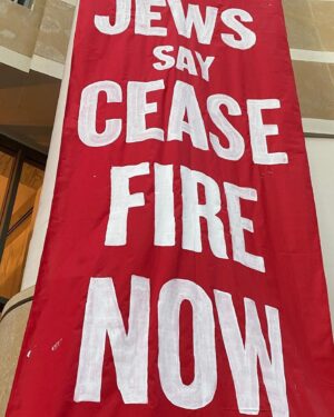 Dallas Goldtooth Instagram - Amazing action to see. @jvpbayarea, @ifnotnowbayarea and over 1000 Jewish people & allies took over the Oakland Federal Building, praying, singing, and chanting in peaceful civil disobedience to demand #CeacefireNow #NeverAgainForAnyone #NotInOurName. It was one of the largest mass arrests in Oakland history I hear. 

(i wasnt there but stand in solidarity)