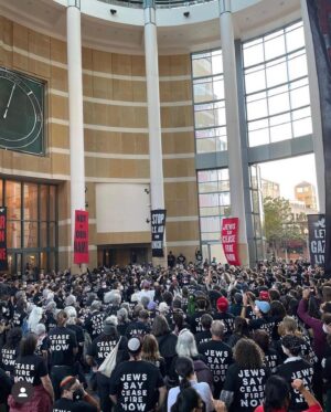 Dallas Goldtooth Instagram - Amazing action to see. @jvpbayarea, @ifnotnowbayarea and over 1000 Jewish people & allies took over the Oakland Federal Building, praying, singing, and chanting in peaceful civil disobedience to demand #CeacefireNow #NeverAgainForAnyone #NotInOurName. It was one of the largest mass arrests in Oakland history I hear. 

(i wasnt there but stand in solidarity)