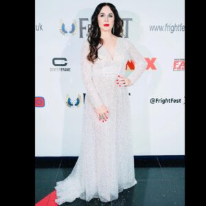 Danielle Bisutti Instagram - “The Blue Rose premiered at London FrightFest and brought otherworldly glamour to the red carpet.” 💙 🌹 

This is just the beginning… 👁️🩸🔪 

📸 @imago.images @alamyltd 
👗 @azazieofficial @michelemariepr 
💍 @pr_solo 
💄 @maccosmetics 
💋 Hair & Makeup @jolandamakeup 

The Blue Rose Red Carpet Credits: 
Written, Directed & Starring - George Baron @sp00kyge0rge 
Produced by Athena Pictures 
@sarena15 @andrapaigegordon 
Line Producer - Nicole Flores 
Cast:
George Baron - “Dalton”
Danielle Bisutti - “Norma Steele”
Nikki Austen Smith - “Sophie”
@nikkoausten 
Sophie Cooper - “Delilah” 
@sophieclarecooper 

Rebecca - “Norma Steele Cosplay” 🔪 💋 
@rebeccacosplaysladyd 

Diana Ferrare-Magaldi - “My mom”💕💝💕
@dianaferraremagaldi 

Thank you to @frightfestuk @clout.pr @icon_pr @joeygirard @bohemiagroup_ @torirobertson__ 

#thebluerose #worldpremiere #normasteele #femmefatale #london #frightfest #indiefilm #redcarpet #filmnoir #surrealism #vintagestyle #actorslife #filmfestival #glamour #azazie #azaziebridalgowns 🤍