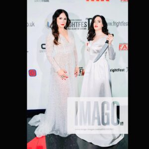 Danielle Bisutti Instagram - “The Blue Rose premiered at London FrightFest and brought otherworldly glamour to the red carpet.” 💙 🌹 

This is just the beginning… 👁️🩸🔪 

📸 @imago.images @alamyltd 
👗 @azazieofficial @michelemariepr 
💍 @pr_solo 
💄 @maccosmetics 
💋 Hair & Makeup @jolandamakeup 

The Blue Rose Red Carpet Credits: 
Written, Directed & Starring - George Baron @sp00kyge0rge 
Produced by Athena Pictures 
@sarena15 @andrapaigegordon 
Line Producer - Nicole Flores 
Cast:
George Baron - “Dalton”
Danielle Bisutti - “Norma Steele”
Nikki Austen Smith - “Sophie”
@nikkoausten 
Sophie Cooper - “Delilah” 
@sophieclarecooper 

Rebecca - “Norma Steele Cosplay” 🔪 💋 
@rebeccacosplaysladyd 

Diana Ferrare-Magaldi - “My mom”💕💝💕
@dianaferraremagaldi 

Thank you to @frightfestuk @clout.pr @icon_pr @joeygirard @bohemiagroup_ @torirobertson__ 

#thebluerose #worldpremiere #normasteele #femmefatale #london #frightfest #indiefilm #redcarpet #filmnoir #surrealism #vintagestyle #actorslife #filmfestival #glamour #azazie #azaziebridalgowns 🤍