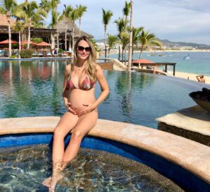 Danielle Demski Instagram - Blue skies and sandy beaches!🏖🥰🇲🇽
.
I spent quite a bit of time in Mexico this last year. This first picture was taken a few months ago, shortly after I found out I was pregnant. At the time, this baby was still our little secret. Flash forward to this weekend (second photo) and now my ever expanding belly tells it’s own story. I’m truly amazed at what my body is capable of and I think I’m able to enjoy and admire it even more the second time around. I’m looking forward to meeting this little person growing inside me but, for now, I’m happy to share my space with this little being and take in every moment🤰❤️
.
.
#traveltuesday #momlife #pregnant #cabo #mexico #instamood