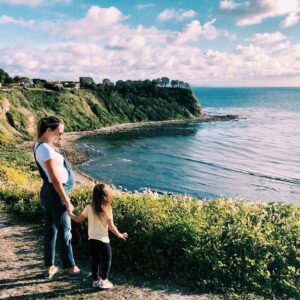 Danielle Demski Instagram - One perk of social distancing is all the quality time I’m spending with my daughter and my husband. We’re taking walks, playing board games, reading, watching movies and...of course, going a little stir crazy🤪 These are our last few weeks as a family of 3 so I’m trying to soak up every minute!
.
What are y’all doing with your time at home??🤔🏡#TogetherApart
.
.
.
#momlife #toddlerlife #9monthspregnant #californiacoast #babybump #beachlife #girlmom #alonetogether #fridayfeels