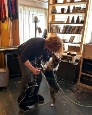 Danny Elfman Instagram - Love trying out new guitars…. And made a new 4 legged friend at the same time!!!