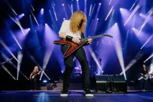 Dave Mustaine Instagram - Droogs,

We have had the most righteous time down here in Latin America. The fans have been insanely loud. Every city has had a different set list, and we've practiced our fingers off on this tour! We hope that the fans got to hear their favorite songs, as well as some deeper tracks that we haven't play for some time. 

Fast forward to today. I was looking down at some papers on the hotel suite desk. and noticed something different about the rooming list. It stated that we are going home from here and I always feel melancholy when we do. 

The four of us have become such good friends, and we are all thriving together in Megadeth. If I may elaborate...

Dirk is an amazing drummer, and I often wonder how I got so fortunate to play with him (he is a lot like Gar), he is a wonderful, humble man who I've learned a lot from. 

James has been our anchor and my mentor for singing out here. He is a killer bassist, who sings so confidently that I can easily accept direction and criticism from him. He has learned every song we play live, note for note, and I love seeing him every morning out here. 

I can't say enough about Teemu, and I don't have to, because you have no doubt seen footage of us together. He is a mad scientist on guitar, he plays ALL previous guitarists parts effortlessly with finesse, and the utmost respect for his predecessor. 

The four of us play, and go over songs every day, reviewing, perfecting, and building up our repertoire to play for you. By the time we reach Europe this summer, we will have even more songs added, to provide the variety to our playlists of songs played in concert. 

Well, that's it for now. I have to get some rest for my body. Tomorrow we are going to take back the night in San Salvador! Mother Nature tried stopping us last time, with insane wind and sideways torrential rain, but the sun is out and we're back!

Hasta mañana chicos!

Dave Mustaine
 
📷: @ryancphoto