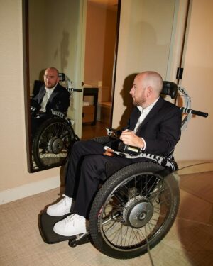 David Holmes Instagram - @davidholmes83 getting ready for his premier for
“The Boy Who Lived Premiere” for @hbo

These images provide a deeply intimate glimpse into the life of a quadriplegic man and the dedicated effort of his team to prepare him. This project not only sheds light on someone’s most vulnerable moments but also offers insight into the experience of disability.

David has been a dear family friend for a long time, and I’ve known him since before the accident. His daily inspiration, as he continues to radiate positivity even in the most challenging of circumstances, truly amazes me. When he asked me to come meet him to shoot just the process of him getting ready for the premier I knew I had to.

If you haven’t watch the documentary I recommend you do so to understand his amazing life. He was the lead stunt double on the Harry Potter franchise which then lead him to having an accident of the filming of the last film.
Finally shout out to: @matt.genovese for assisting me on the day.