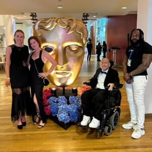 David Holmes Instagram - The BAFTAs last night was a fun adventure. My documentary was nominated but unfortunately didn’t win. I want to congratulate Ellie Simmonds and her team for the well deserved win and also say congrats to every one at the event. It's still unacceptable that I was the only stunt performer in the room and if I’d of won I’d have said something on stage about my department being overlooked. 

Honestly it was fun but unless BAFTA starts recognising stunts I wouldn’t do it again. I didn’t see any other department members who were willing to risk their lives and bodies for the sake of storytelling and I just sat in a room too cold for a quadriplegic surrounded by people from a whole industry who don’t think stunt performers deserve a category.

 #StuntsForBafta  #Bafta #Quadriplegic #NoArmsLegsAnNoVoice #PenguinOnWheels