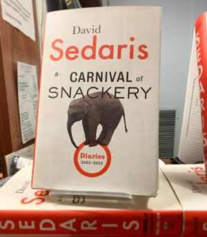 David Sedaris Instagram - A CARNIVAL OF SNACKERY is here (and available wherever books are sold). If it’s navel-gazing you’re after, you’ve come to the wrong place; ditto treacly self-examination. This book has everything: a fight between two men on a bus, a fight between two men on the street, pedestrians being whacked over the head or gathering to watch as a man considers leap­ing to his death. There’s a dirty joke shared at a book signing, then a dirtier one told at a dinner party—lots of jokes here. Plenty of laughs.
 
Photo from last night at @mcnallyjackson. Link in bio to get your copy.

#davidsedaris #acarnivalofsnackery