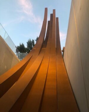 Dayle Haddon Instagram - Dinner at the supremely talented Bernar Venet and his beautiful wife  Diane in Le Muy. Named ‘the greatest living artist in France’ his  sculptures soar into space transferring the feeling of power and yet giving an opposing sense of lightness. The oval ‘eye’ captures the sky yet inside the colors slowly change giving another perception every few seconds of the frames space. Calming and zen! The cortin steel beams in the evening seem like airy dinosaur bones abandoned in the night thousands of years ago. Dreamy yet powerful and inspiring! 
Thank you @bernarvenetstudio and @dianevenet for a wonderful dinner and very inspiring evening. I came away feeling i can do more in the world. 
Thank you @flammariondebokay for this wonderful introduction. @venetfoundation @chateaufontainebleau #art #sculptures #bernarvenet #greatartists #inspiration #lemuy