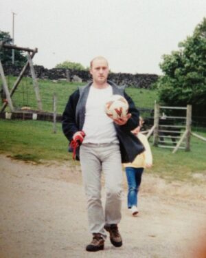 Dehenna Davison Instagram - Thinking about Dad today on what would have been his 52nd birthday. In this pic we’d taken the dog for a walk and gone for a kickabout. You can just spot little me behind him with a can of what looks like Coke - very on brand!

I don’t have many pictures of Dad, and in most of those I do have he looks dead grumpy! But he wasn’t at all. He was the most fun-loving prankster I ever had the pleasure of knowing. Every year on 22nd December I raise a glass, and wish he was here to eat too many mince pies on Christmas ❤️