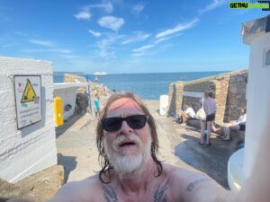 Donal Logue Instagram - The Forty Foot. Ireland— the only country in the world where my freckly, gingerness isn’t out of place in a sea swimming locale.