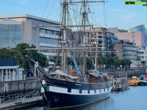 Donal Logue Instagram - Just arrived in Dublin, looked out my window, and saw two familiar spars that immediately filled me with joy. It was Jeanie.
 The Jeanie Johnston became famous during the time of the famine. Unlike many of the “coffin ships” of the era, the Jeanie Johnston made 16 successful trans-Atlantic crossings starting in 1848, and although she sometimes held as many as 240 passengers, no one ever died aboard her. 
 I feel a special affinity for this (granted) replica of the original ship (which sank in 1855– again, no lives were lost) because the finishing work on her was done in Fenit Harbor, my father’s home village in Kerry. We knew many who worked on the project. My father and I were allowed on the Jeanie Johnston before she was finished and my pops was even offered a spot as a hand on her maiden voyage to the United States. My father wished he could, but had to pass on the opportunity; a difficult decision for a sailor.
 A year later, I was walking down the Westside by Battery Park in New York City when I saw a handsome, two sparred ship sailing up the Hudson River. I knew it was the Jeanie Johnston. She had made it safely to the Azores and across the Atlantic, just as she had so many times during the mid-19th Century during the darkest time in Irish History.
#IrishHistory #jeaniejohnstone