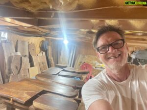 Donal Logue Instagram - Hi. I’m Donal. I’m terrible at social media and photography, but if you want an amazing walnut serving platter or cutting board, hit me up or go to @frisonloguehardwoods and frisonloguehardwoods.com, where these will be listed soon. Oh, and please, give us a follow if you wouldn’t mind! The two center platters are over three and a half feet long, so they are serious heirloom show pieces. If you could see the curl in this grain up close- dang. These slabs were special. We have a ton of walnut logs, so I’m making a heap of them. It’s a time consuming process— Kevin sourcing the logs through his tree service and hefting them up to the mountain, running the logs through the mill, dry kilning the slabs to get their internal temp to 160 to protect them from rot and bugs and to take their moisture content down, flattening them by using a router on tracks where you make a zillion passes and adjust 1/16 of an inch at a time, sanding (and in the case with one of the long platters in the center- taking an exacto knife to sawdust compacted wormholes), and then sealing and staining and/or oiling and beeswaxing. When I get better at stories, I’ll film the process. We ship anywhere in the world and if you are in LA, I do regular runs betwixt there and Oregon. My favorite piece is a Madrone Burl I dado cut to create a traditional Japanese slipper. Madrone is a local species of hardwood here in Oregon- its the favorite of super high end car makers for use in their interior inlays for a reason. Its just incredible wood and is sadly seen by timber companies as a pestilence and burned by the zillions of tons. It’s special, and has a beautiful orangey fire-like glow to it.