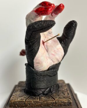Doug Bradley Instagram - NEW BATCH PRE-ORDER ALERT!!!!! 
The last one went great thank you everyone who purchased one!
Inspired by the iconic moment from Hellraiser Ill: Hell On Earth, created by Makeup Effects artist Paul Jones @pauljonesfx for Image Animation. Pinhead scornfully removed two worm-adorned pins from his head and drove them through the palms of his hands in a parody of Christ’s crucifixion, then taking Jesus’ own words for himself and blasphemously declared “I am the Way”.
This statue was conceived by Doug’s wife, Steph Sciullo @stephsciullo , the hand itself was cast from @officialdougbradley hand by Steph (in their kitchen!). The base and Pinhead’s ‘finger-stalls’ were designed and sculpted by makeup effects artist Kyle Roberts.
It is casted in a durable Urethane resin, and is  11” tall, 9” deep, 8” wide.
Each piece is hand-finished by Kyle and individually autographed by Doug, making each one a unique item.

Pre-orders (#31-66) are priced at $400 plus shipping and handling and will start shipping in December, 2024. (Note: There may be some delays due to a film project I may end up on. I will keep you informed if that happens.) Available now, First Come First Serve!Link is in my Bio! #hellraiser #hellraiser3  #dougbradley #pinhead #hellpriest #clivebarker #pauljonesfx #stephscuillo #sculpture #sculptor #originalart #fanart #tolinfx #krobertsfx #barefootfxstudio #horror #horrormovies #collectibles #horrorart #horrorcollector #collection #cenobites