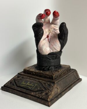 Doug Bradley Instagram - NEW BATCH PRE-ORDER ALERT!!!!! 
The last one went great thank you everyone who purchased one!
Inspired by the iconic moment from Hellraiser Ill: Hell On Earth, created by Makeup Effects artist Paul Jones @pauljonesfx for Image Animation. Pinhead scornfully removed two worm-adorned pins from his head and drove them through the palms of his hands in a parody of Christ’s crucifixion, then taking Jesus’ own words for himself and blasphemously declared “I am the Way”.
This statue was conceived by Doug’s wife, Steph Sciullo @stephsciullo , the hand itself was cast from @officialdougbradley hand by Steph (in their kitchen!). The base and Pinhead’s ‘finger-stalls’ were designed and sculpted by makeup effects artist Kyle Roberts.
It is casted in a durable Urethane resin, and is  11” tall, 9” deep, 8” wide.
Each piece is hand-finished by Kyle and individually autographed by Doug, making each one a unique item.

Pre-orders (#31-66) are priced at $400 plus shipping and handling and will start shipping in December, 2024. (Note: There may be some delays due to a film project I may end up on. I will keep you informed if that happens.) Available now, First Come First Serve!Link is in my Bio! #hellraiser #hellraiser3  #dougbradley #pinhead #hellpriest #clivebarker #pauljonesfx #stephscuillo #sculpture #sculptor #originalart #fanart #tolinfx #krobertsfx #barefootfxstudio #horror #horrormovies #collectibles #horrorart #horrorcollector #collection #cenobites